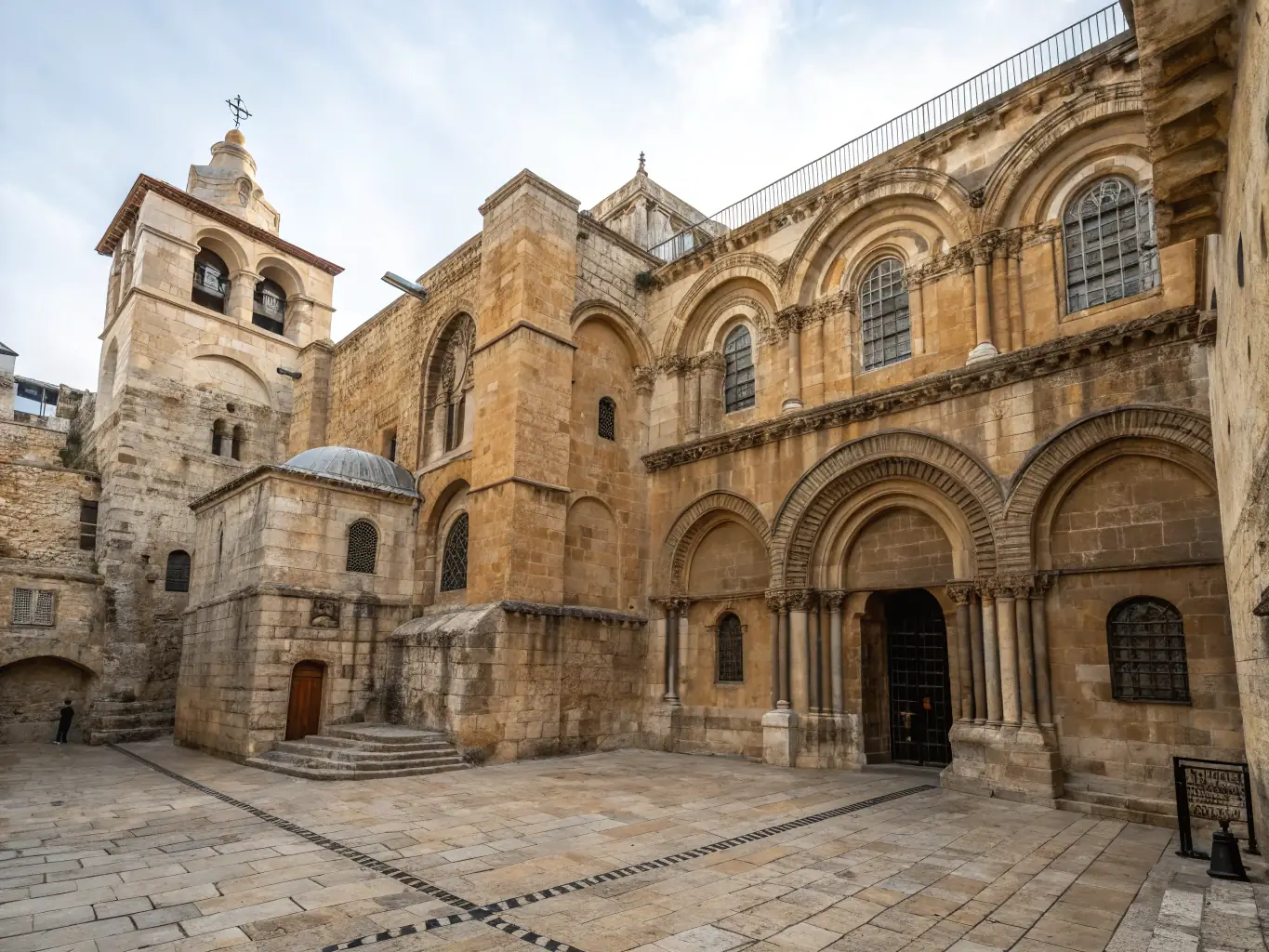A beautifully restored stone facade of the Luxé church, showcasing intricate carvings and architectural details, bathed in the soft light of dawn.